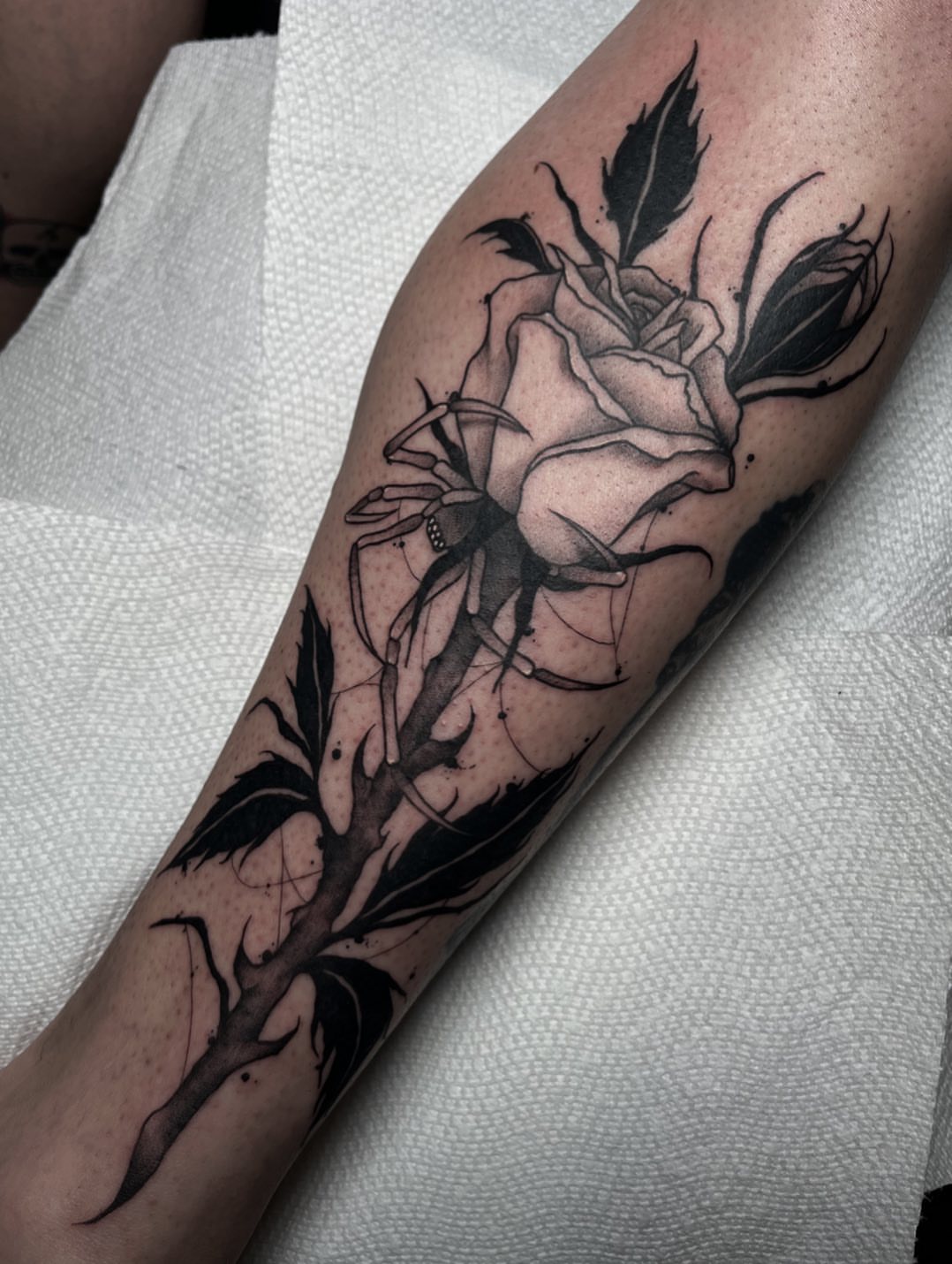 Rose black and grey tattoo on the forearm by Ty’s Tattoos