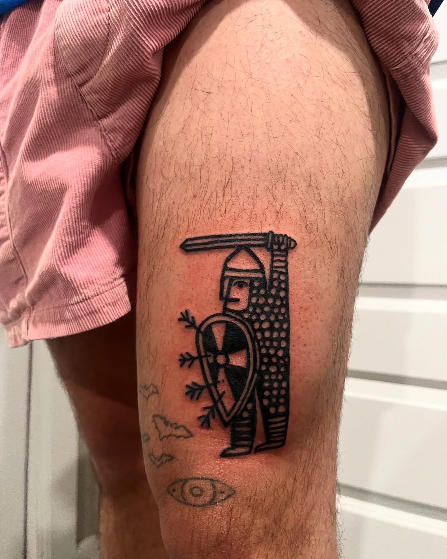 Medieval knight black and grey tattoo on the thigh by layne
