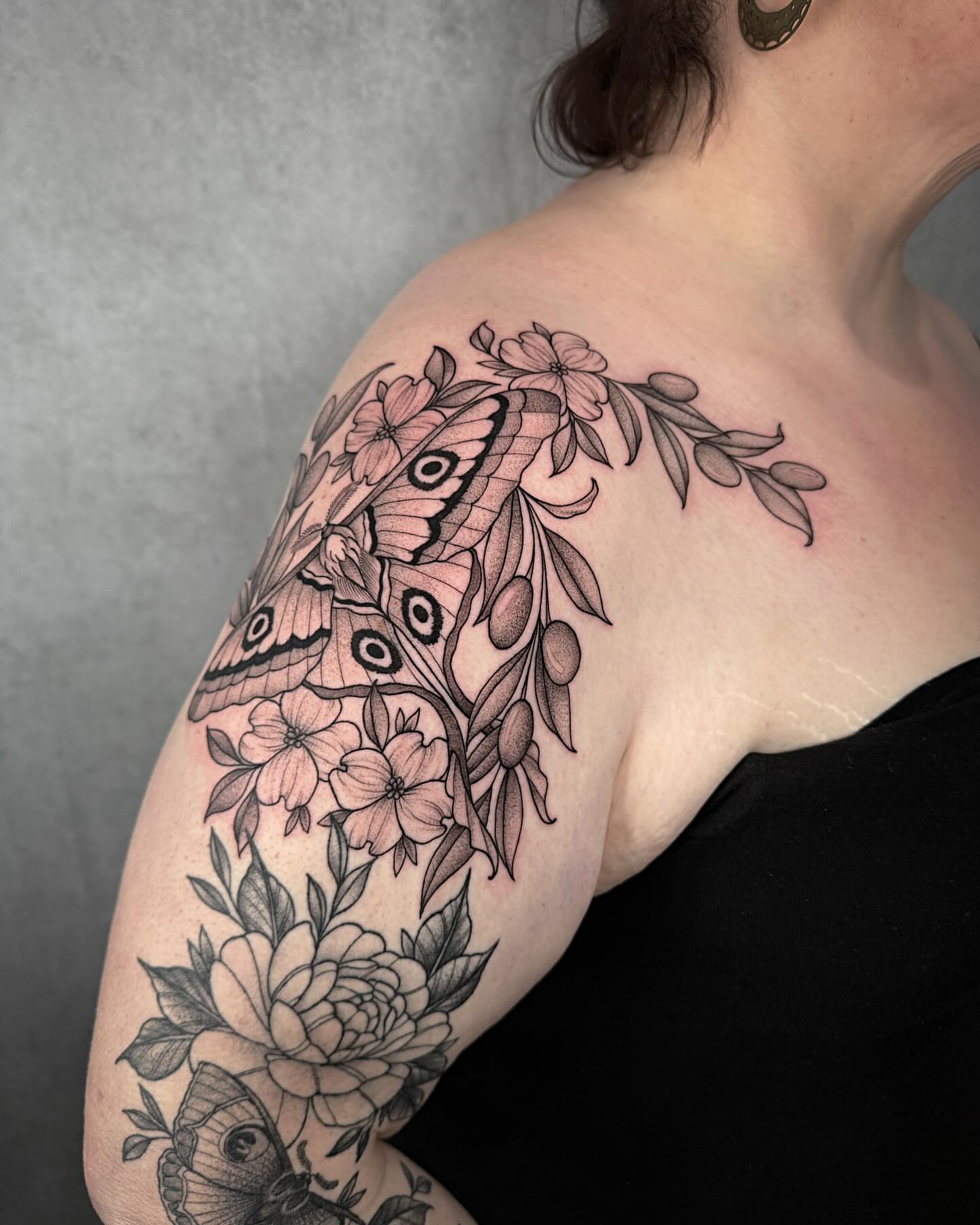 Butterfly and flowers black and grey tattoo on the shoulder by Mallory Miller π³οΈβπ Eugene