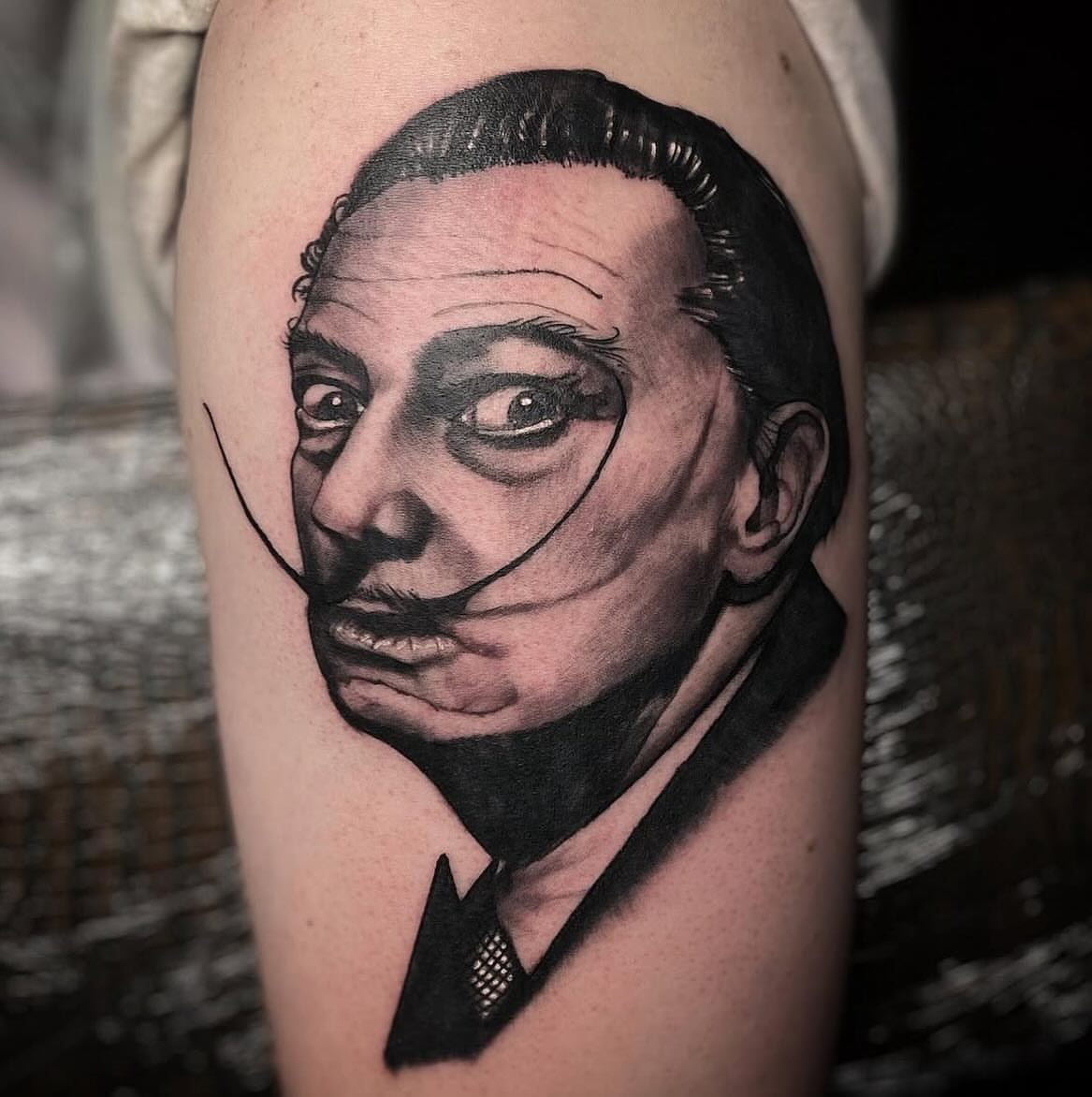 Salvador dali realism tattoo on the forearm by Jonathan Gearheart