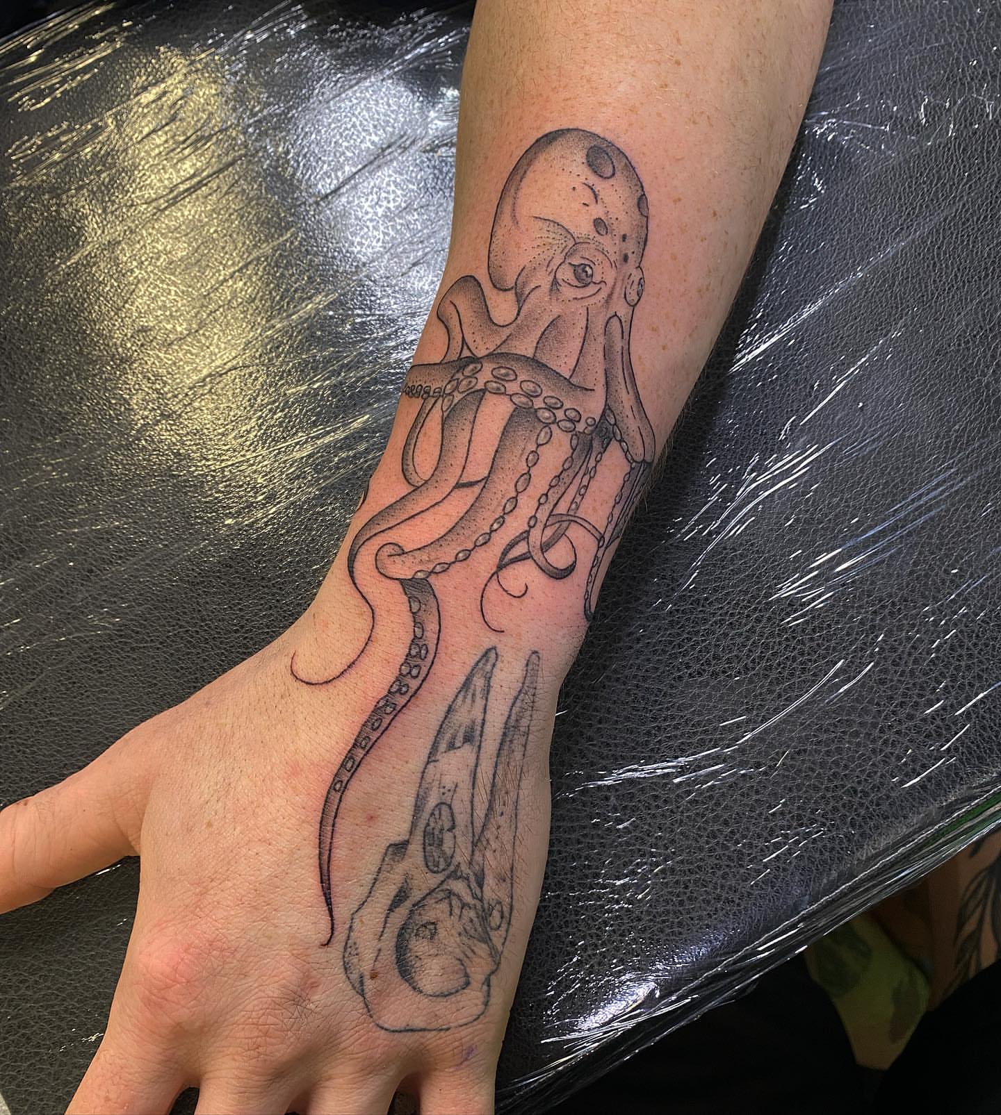 Octopus realism tattoo on the foot by Spencer Jones Tattoos