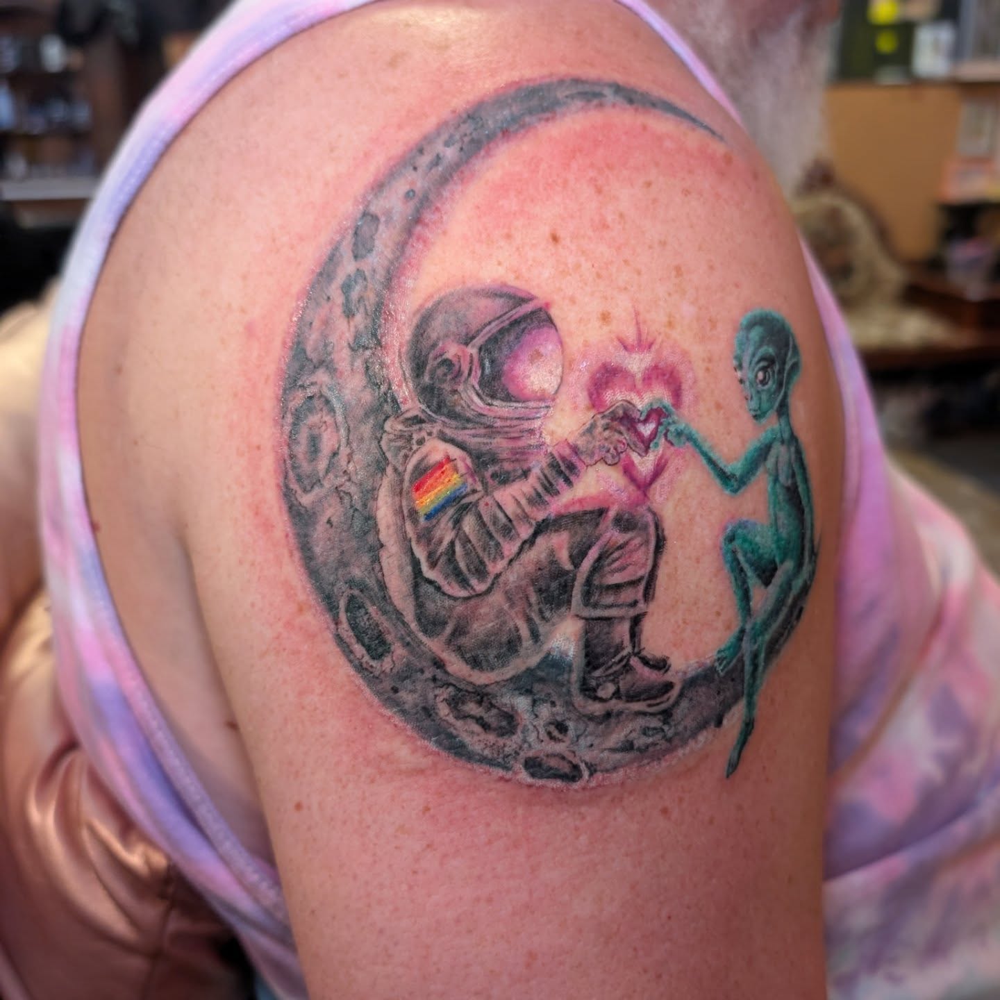 Astronaut and alien realism tattoo on the shoulder by Cat