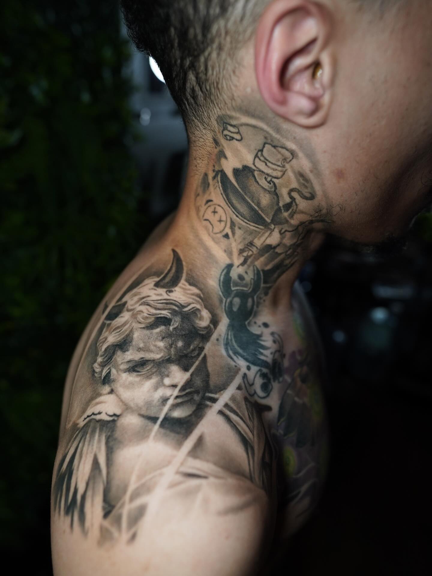 Statue head realism tattoo on the shoulder by Erick Satchell II