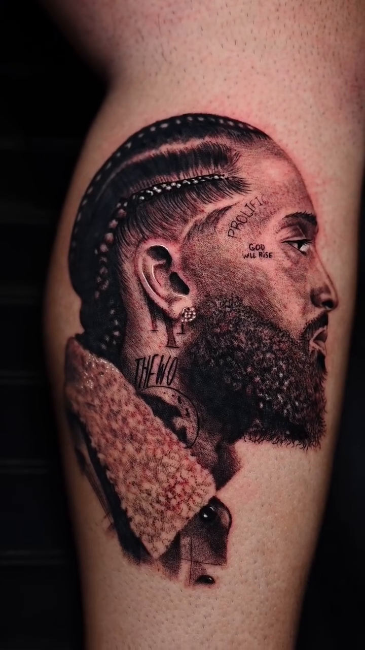 Portrait of Nipsey Hussle realism tattoo by Tam Nguyen