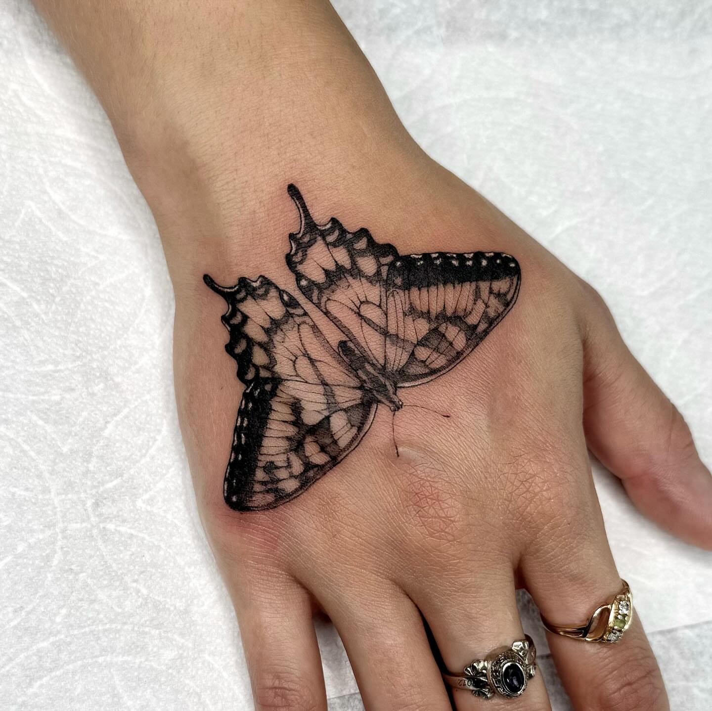 Butterfly realism tattoo on the hand by taline