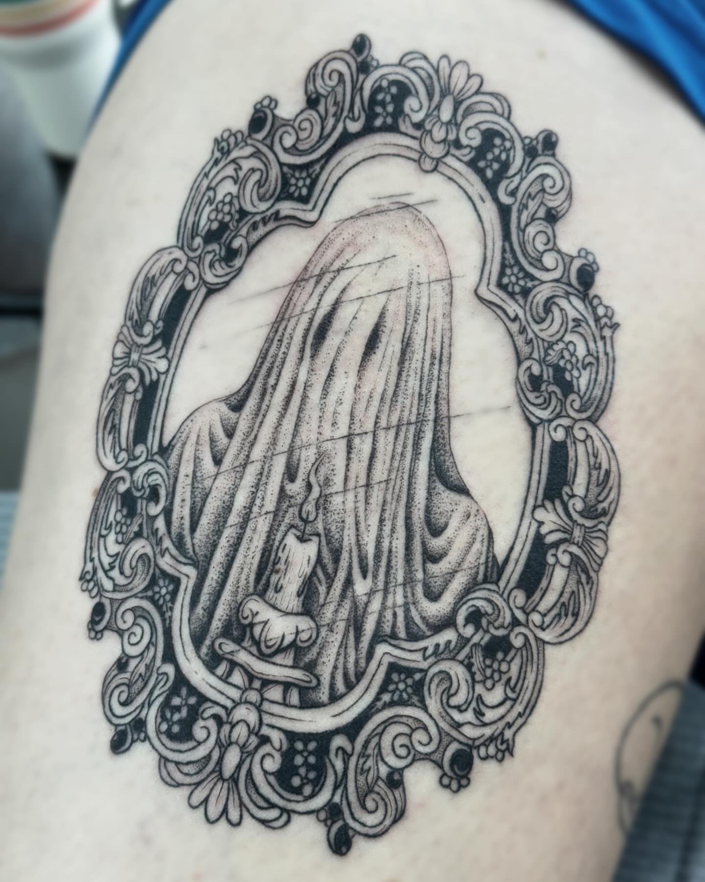 Veiled figure dotwork tattoo on the thigh by Writhe Grey