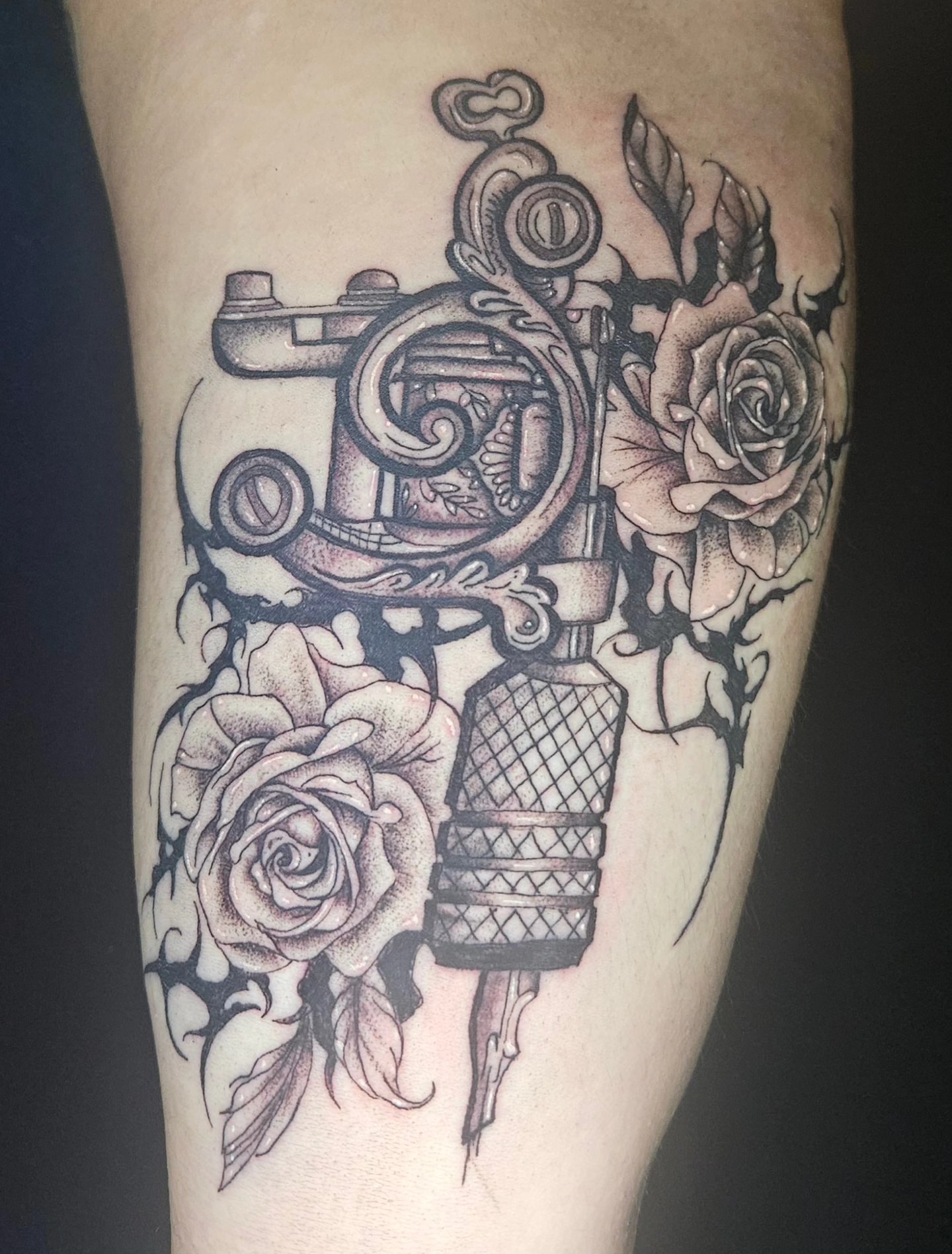Tattoo machine and roses realism tattoo on the forearm by Ari🖤
