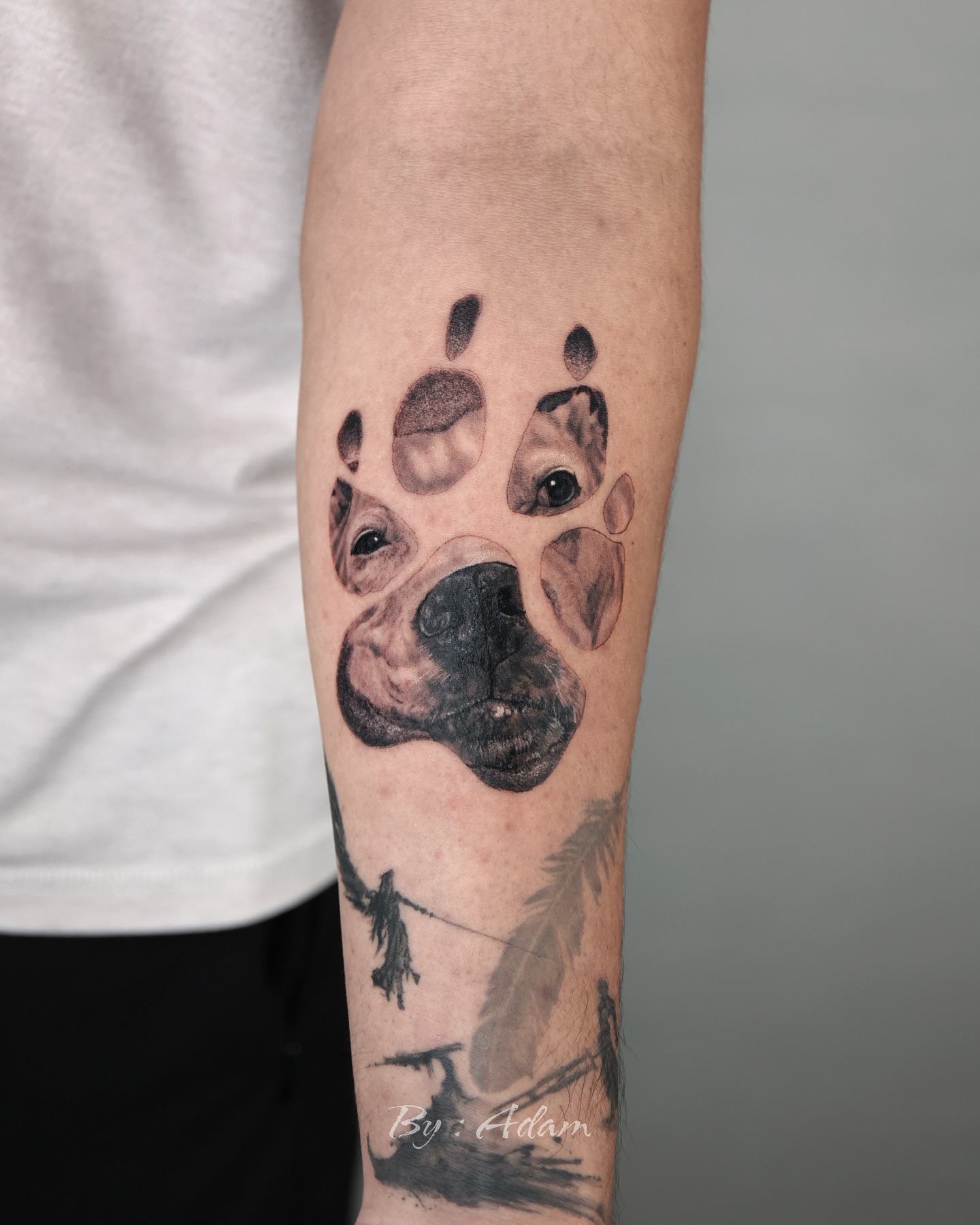 Dog paw realism tattoo on the forearm by Adam_Zhiwei Xu(Tattooist)