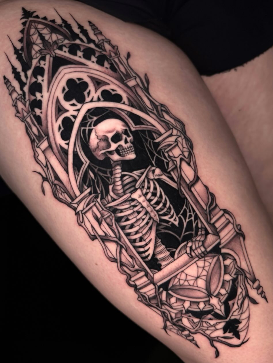 Skeleton in gothic arch dark realism tattoo on the thigh by James Boag