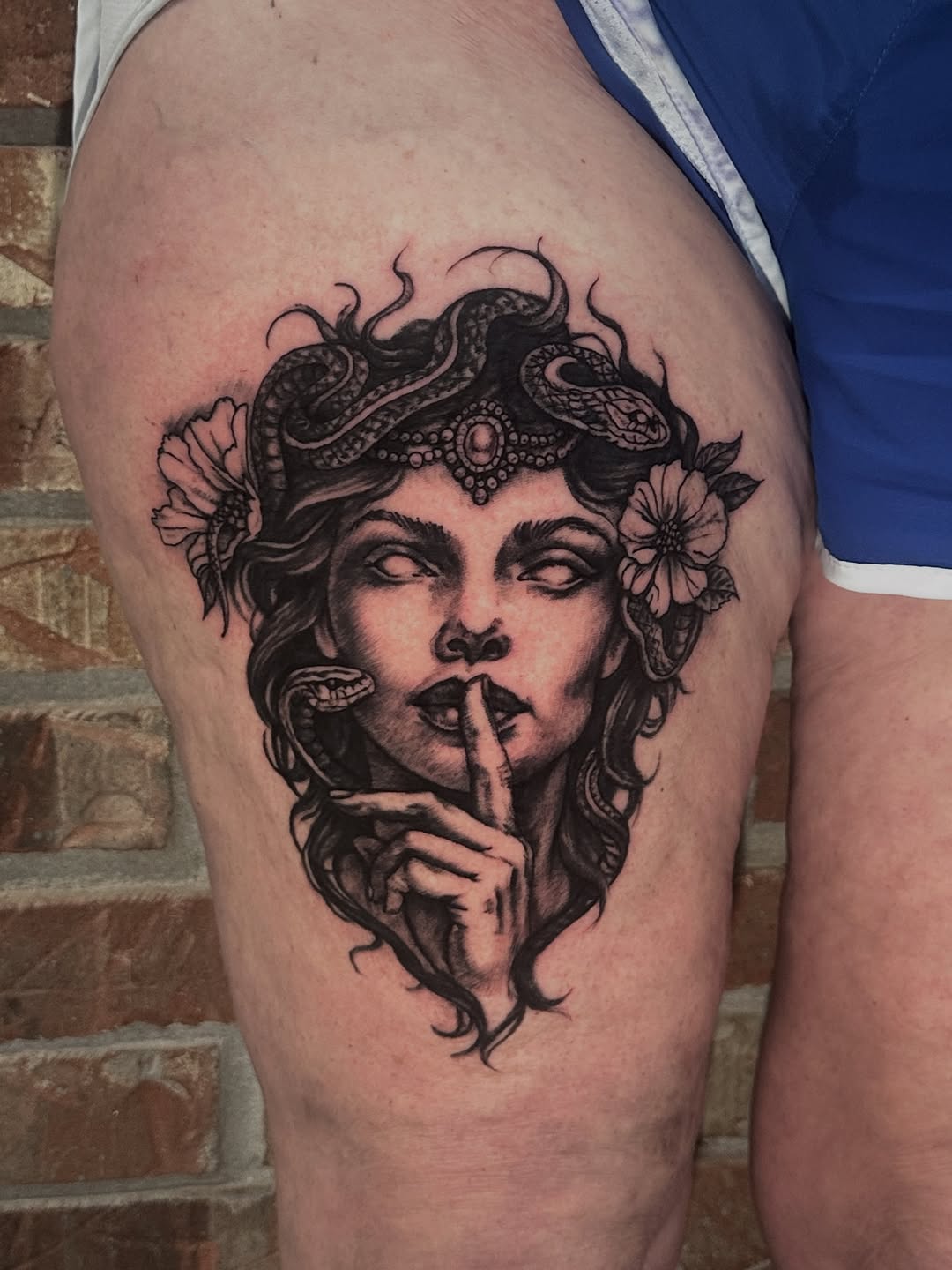 Medusa portrait realism tattoo on the thigh by Matthew Tattooer Harman