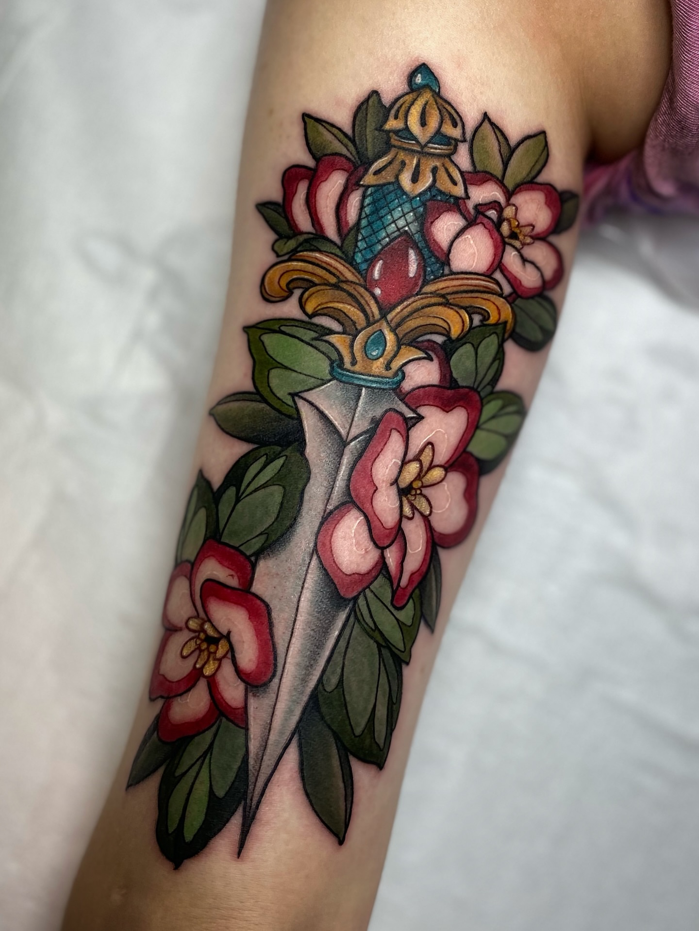 Floral dagger American traditional tattoo on the forearm by Tayler Pearson, Fort Collins, Colorado