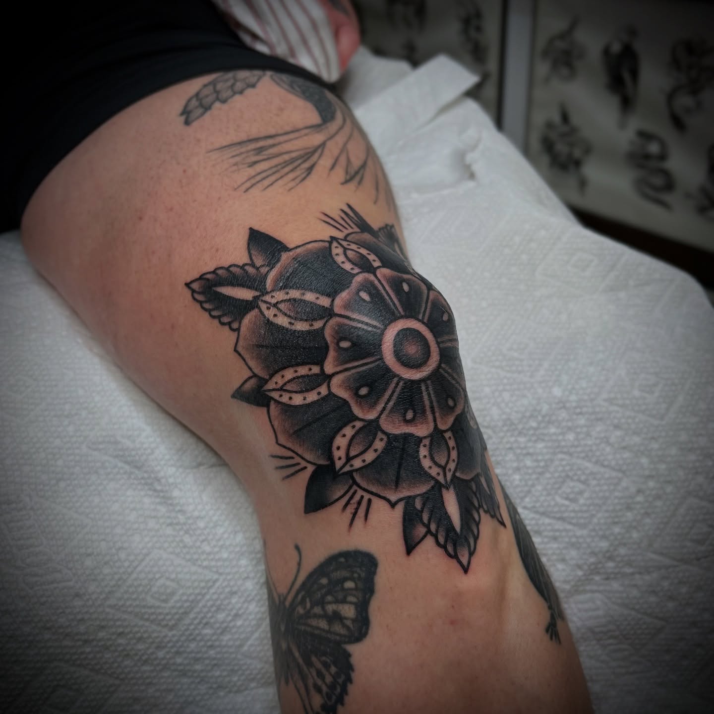 Flower black and grey tattoo on the thigh by Bright-bold-classic Tattoos, North Hills
