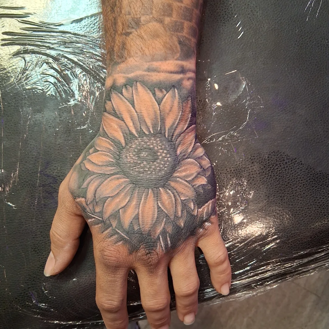 Sunflower realism tattoo on the hand by Dave Johnson, Billings, Montana