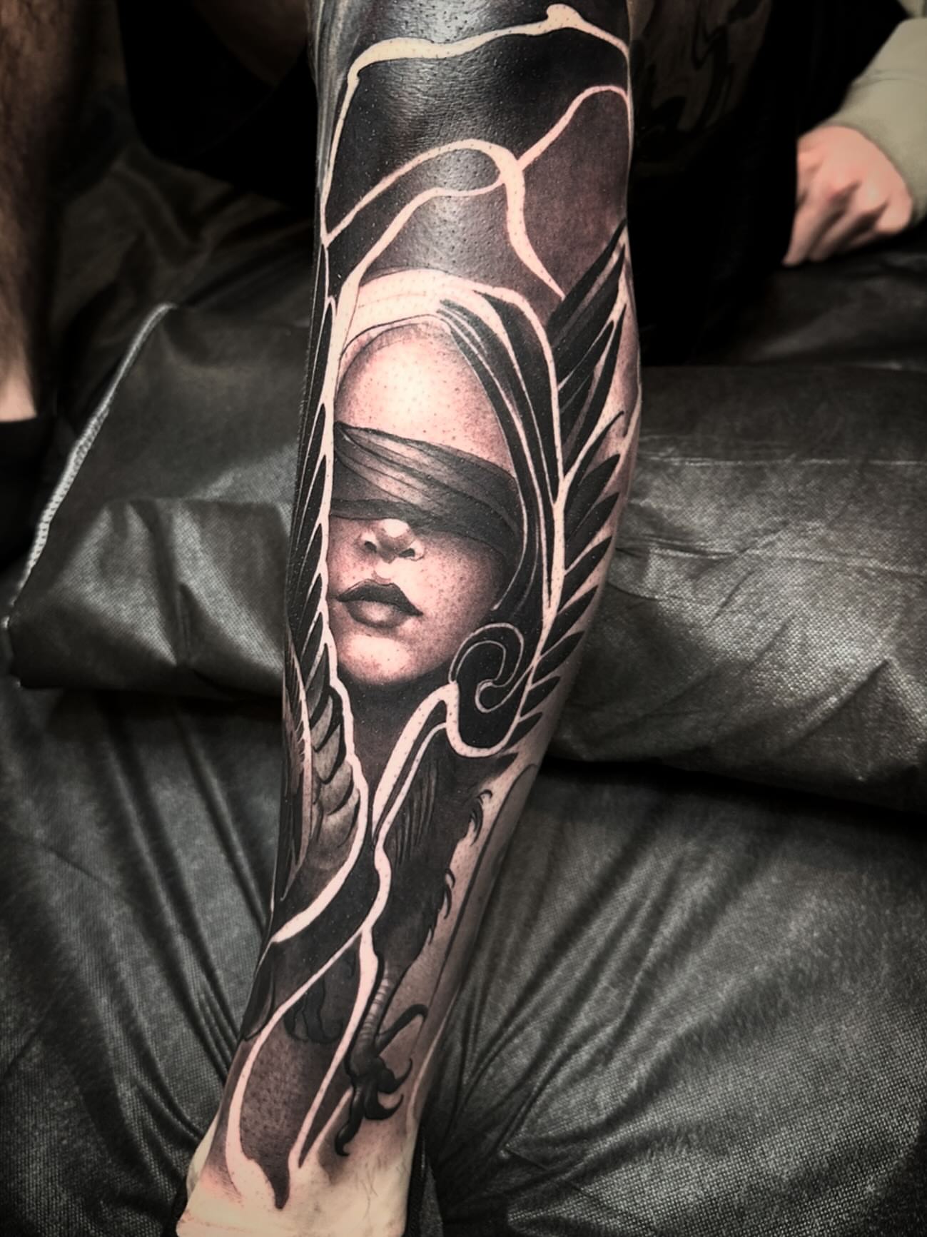 Blindfolded woman realism tattoo on the forearm by Nathan Adsit