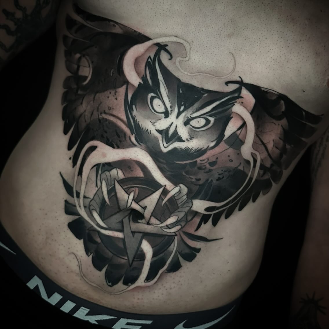 Owl black and grey tattoo on the ribs by Nathan Adsit
