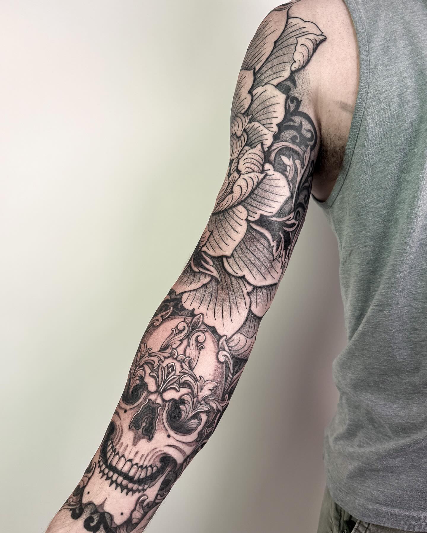 Skull and floral ornamental tattoo on the forearm by Jamie Beach, Wheat Ridge, Colorado