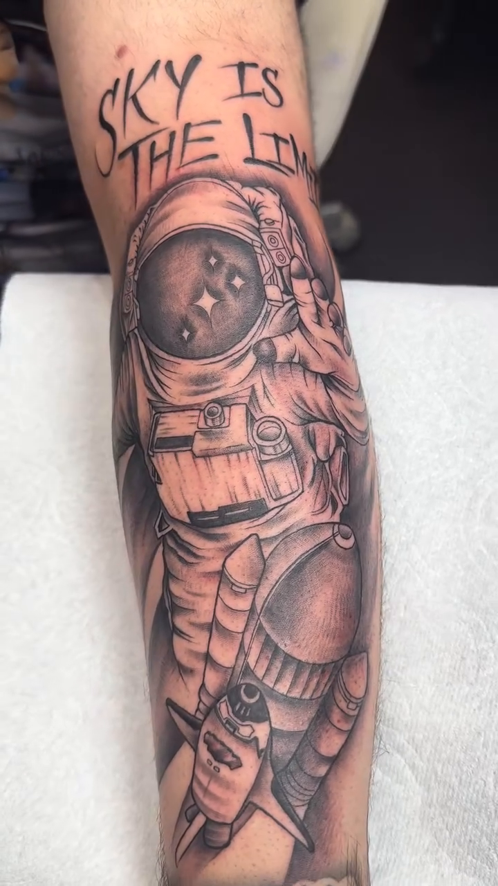 Astronaut with text realism tattoo by Yari, Los Angeles, California