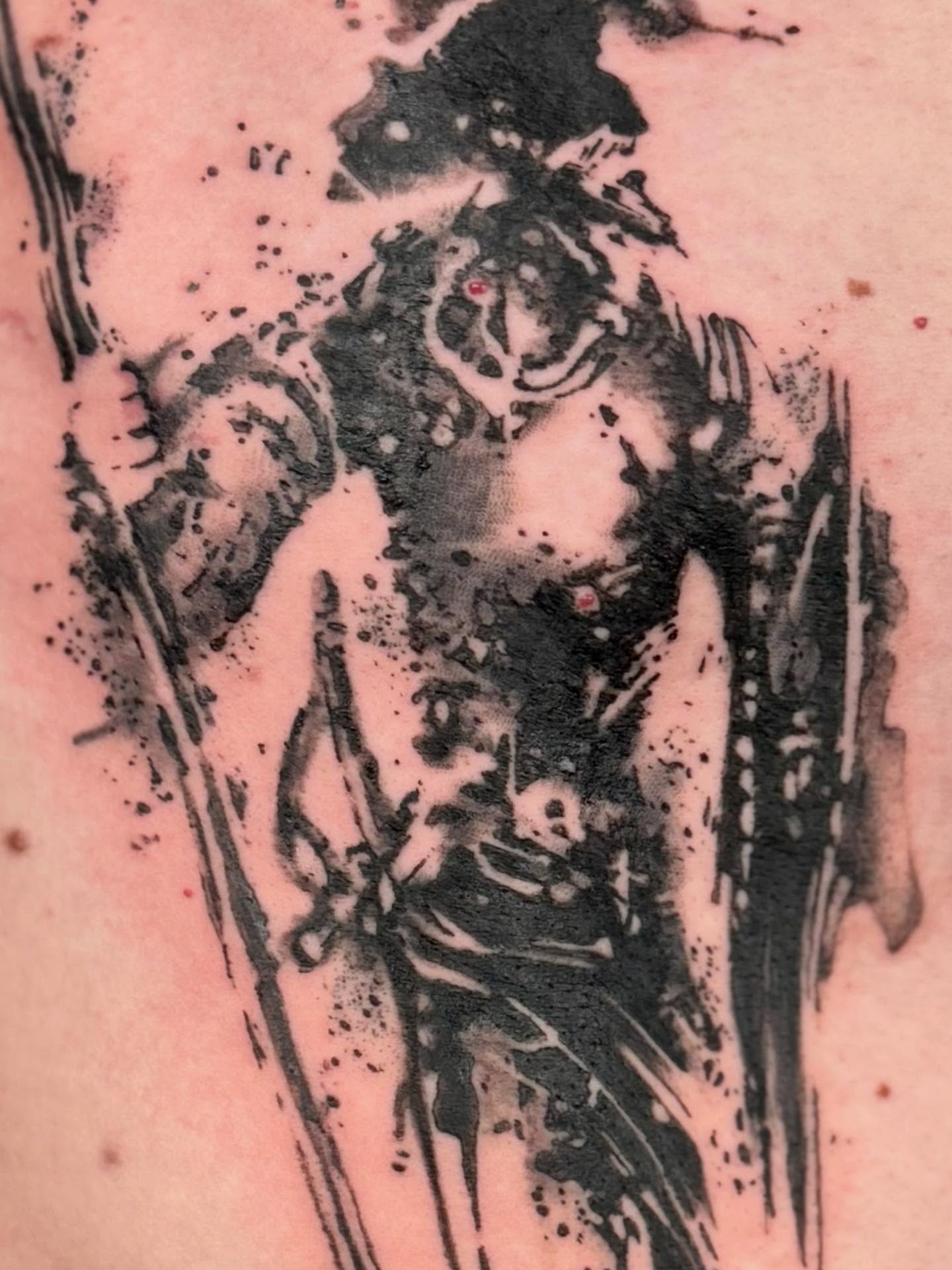 Woman with sword black and grey tattoo on the upper arm by Gene Coffey, New York, New York
