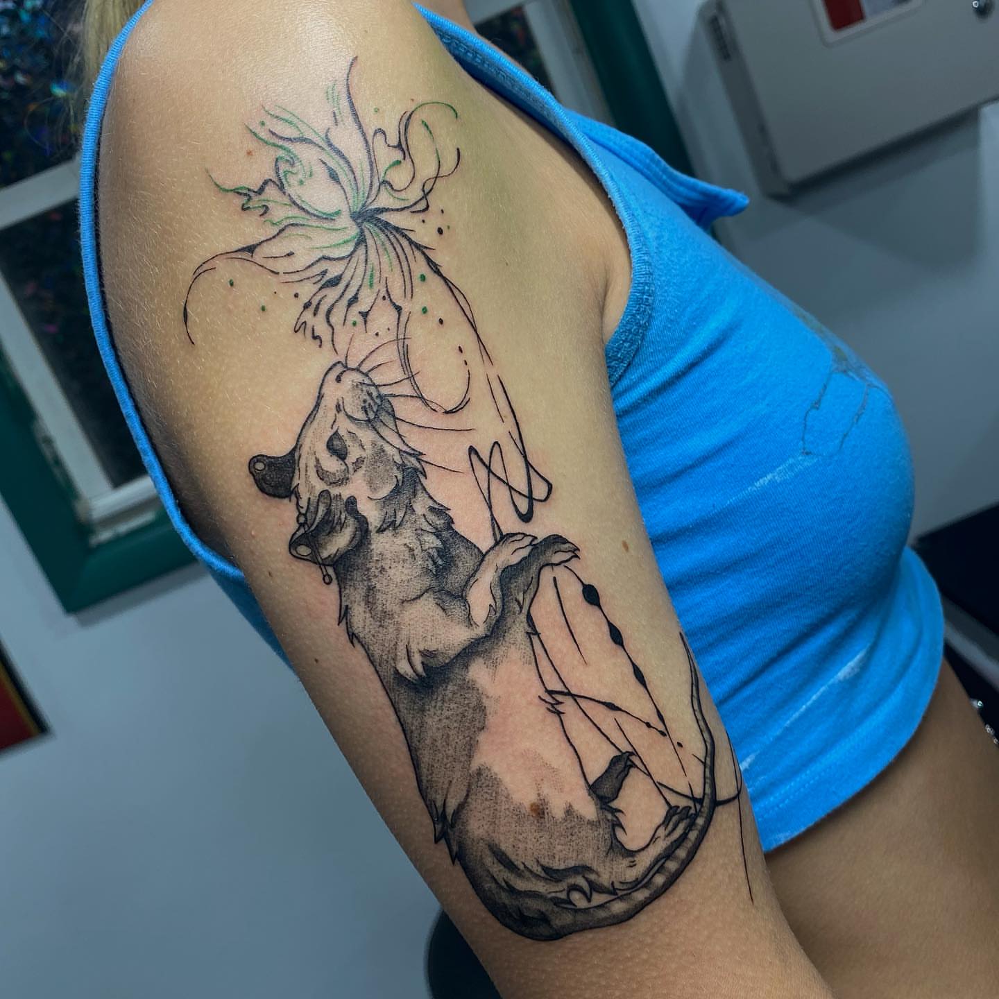 Rat and flower realism tattoo on the forearm by Maddie Neibert