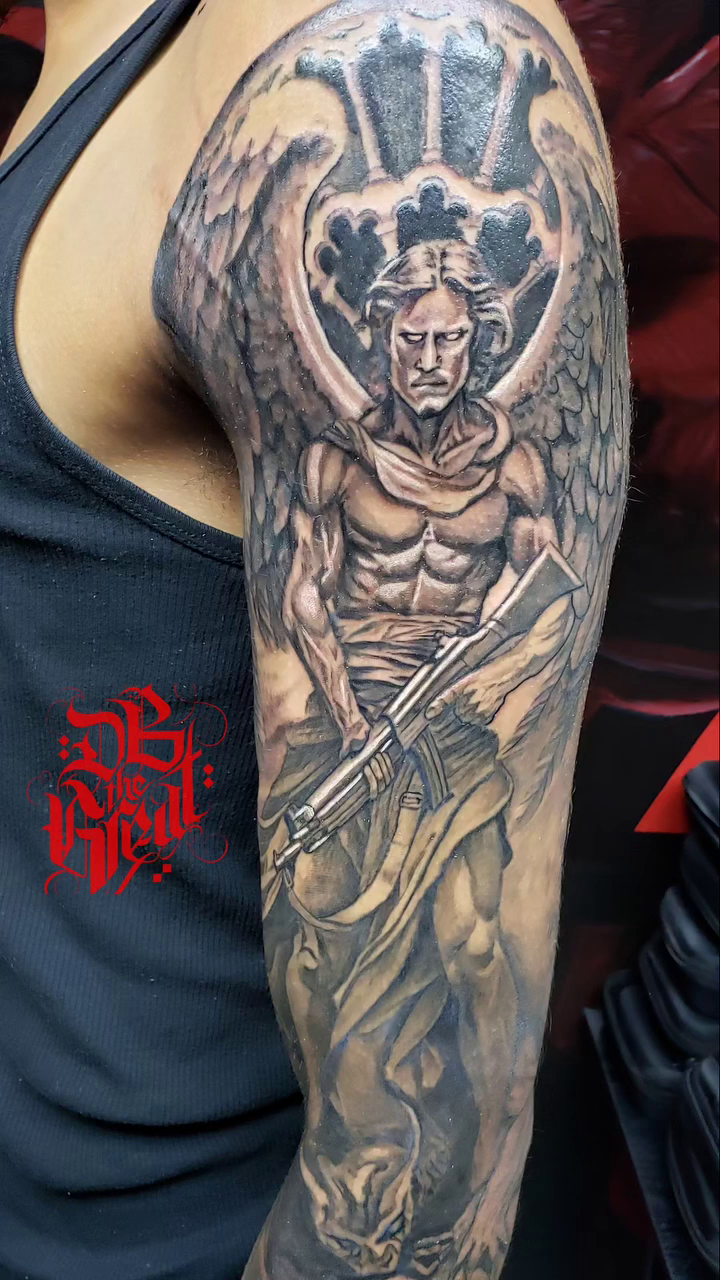 Angel with a rifle realism tattoo by Dannie Blythewood