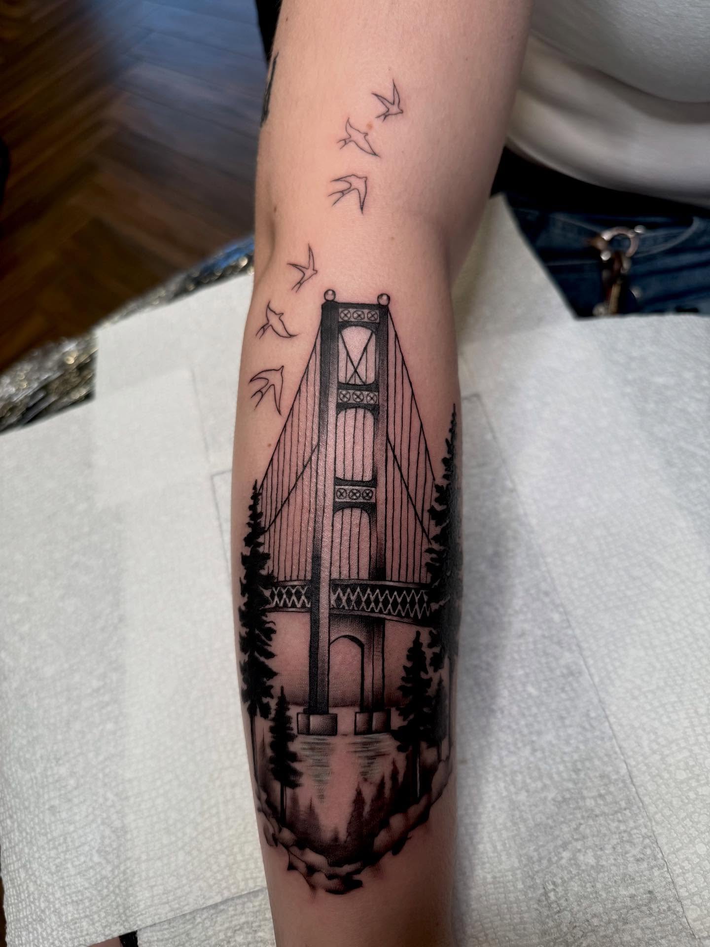 Golden gate bridge black and grey tattoo on the forearm by KZ