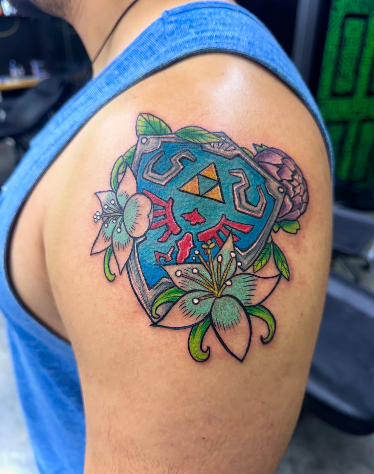 Zelda shield American traditional tattoo on the shoulder by Kevin A. Salinas ๐จ๐ด, Houston, Texas