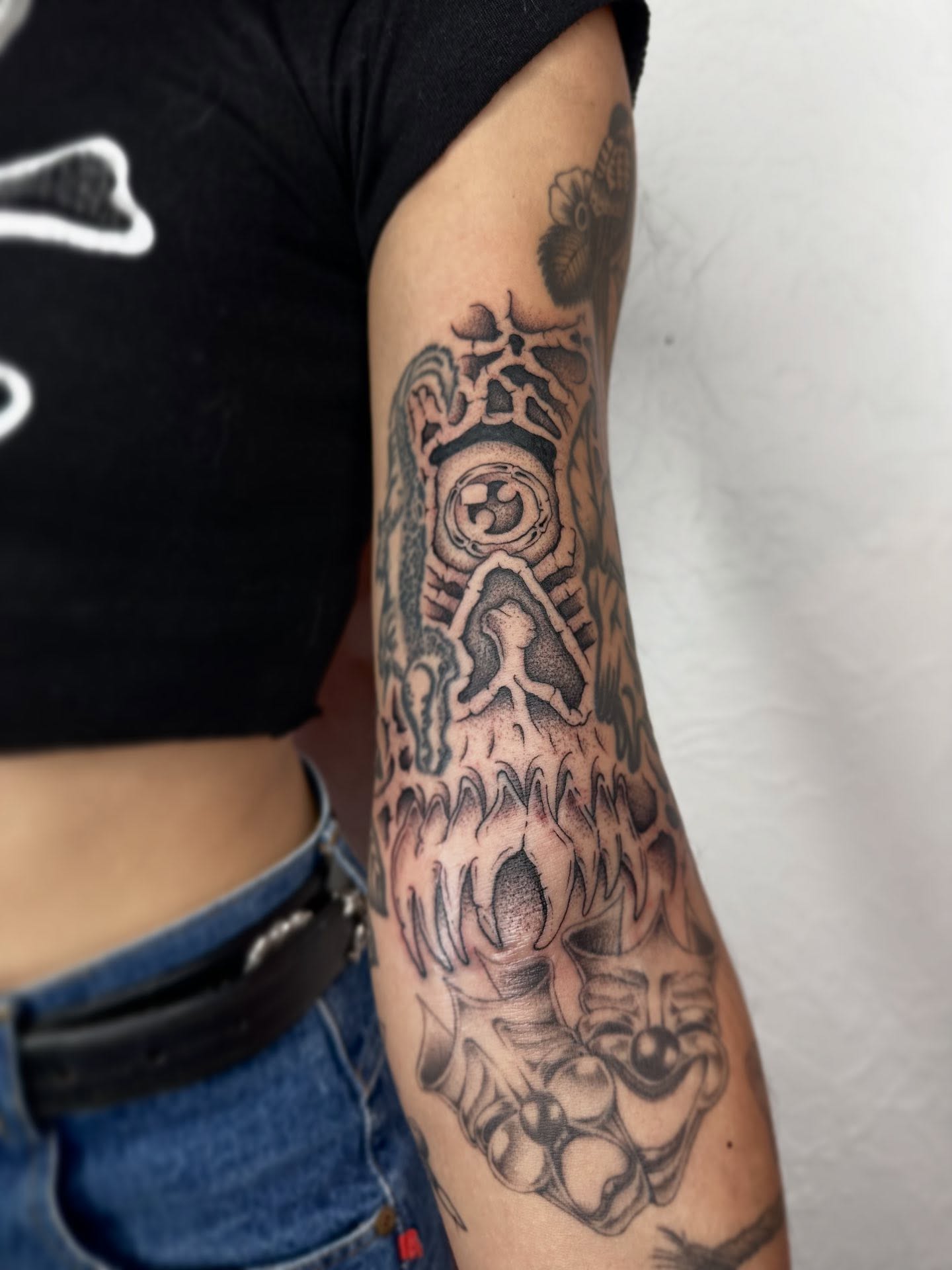 Skull with mechanical elements geometric tattoo on the forearm by Elijah Edwards