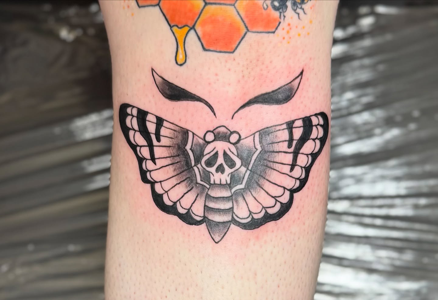 Butterfly skull black and grey tattoo on the forearm by Minxxy Tattoos