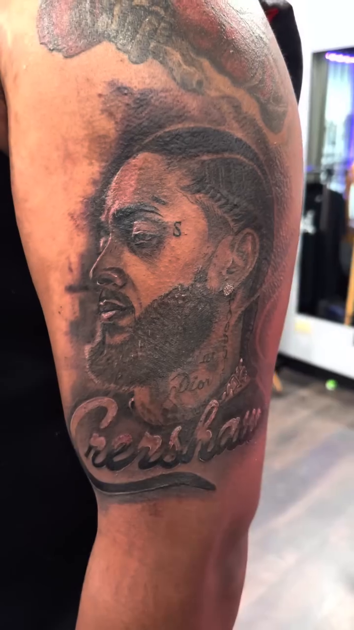 Portrait of Nipsey Hussle realism tattoo by ๐ฝ๐๐๐๐๐๐๐ ๐ถ๐๐๐
