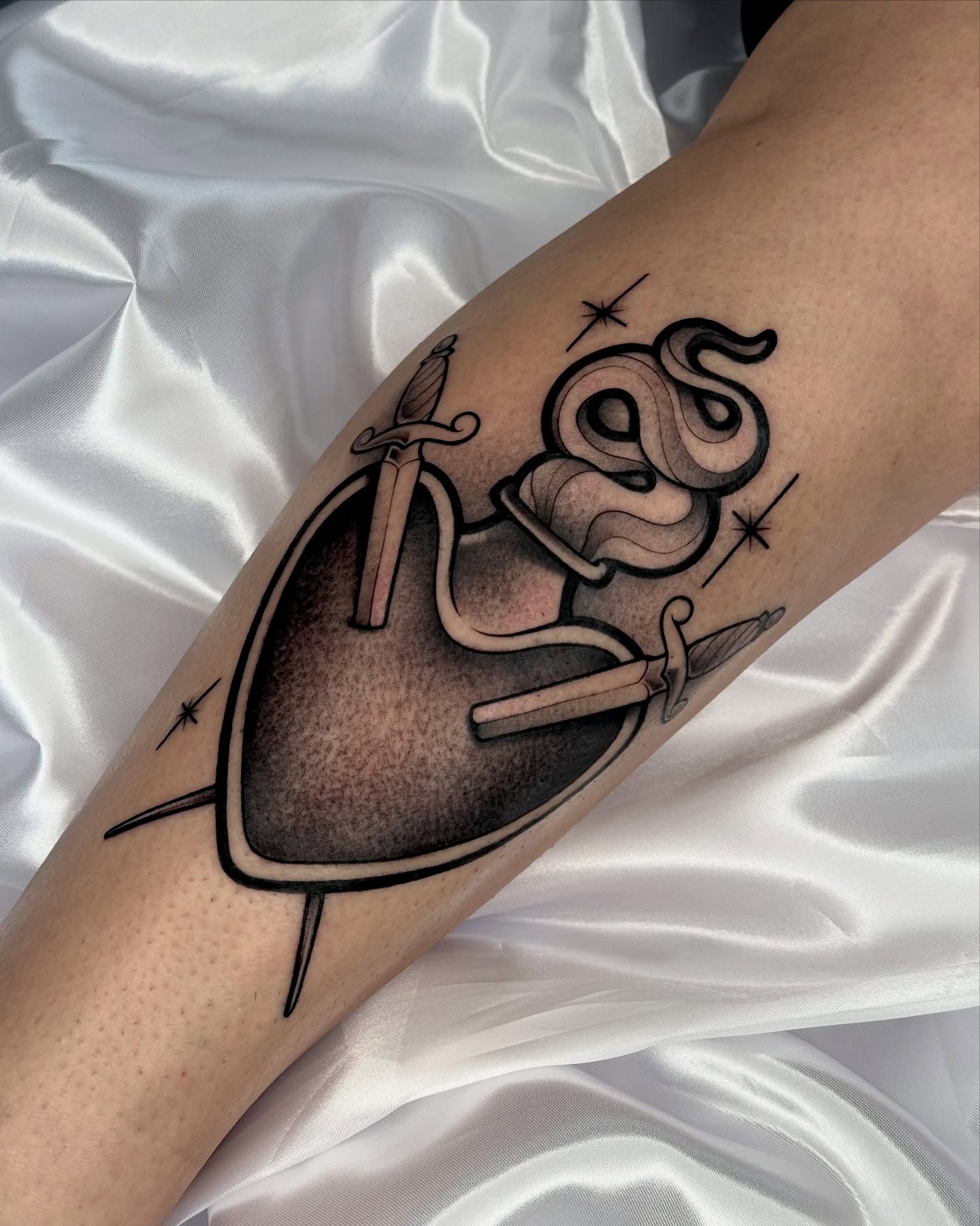 Sword and snake American traditional tattoo on the forearm by Gabrieli Folha