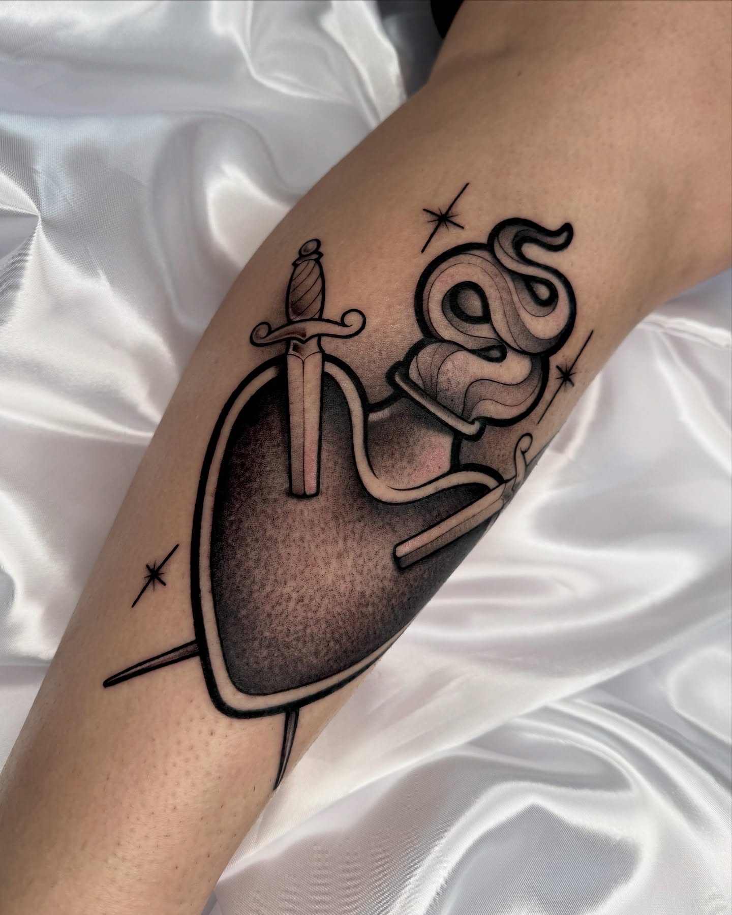 Sword and snake black and grey tattoo on the forearm by Gabrieli Folha