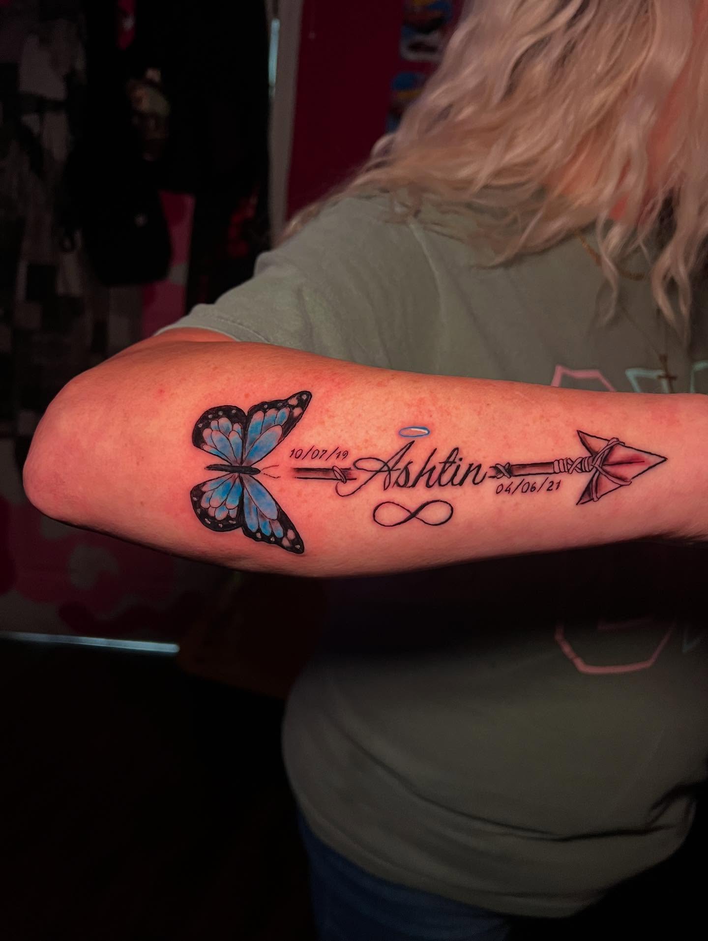 Butterfly and arrow dotwork tattoo on the forearm by Glass Inkk