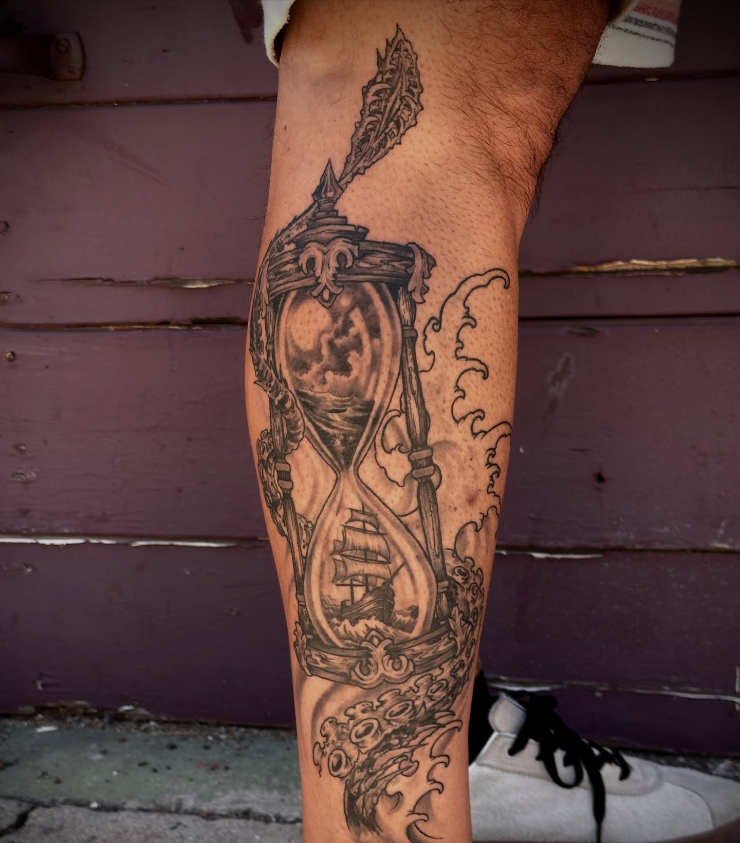 Hourglass and ship realism tattoo on the forearm by Culleton Paramore