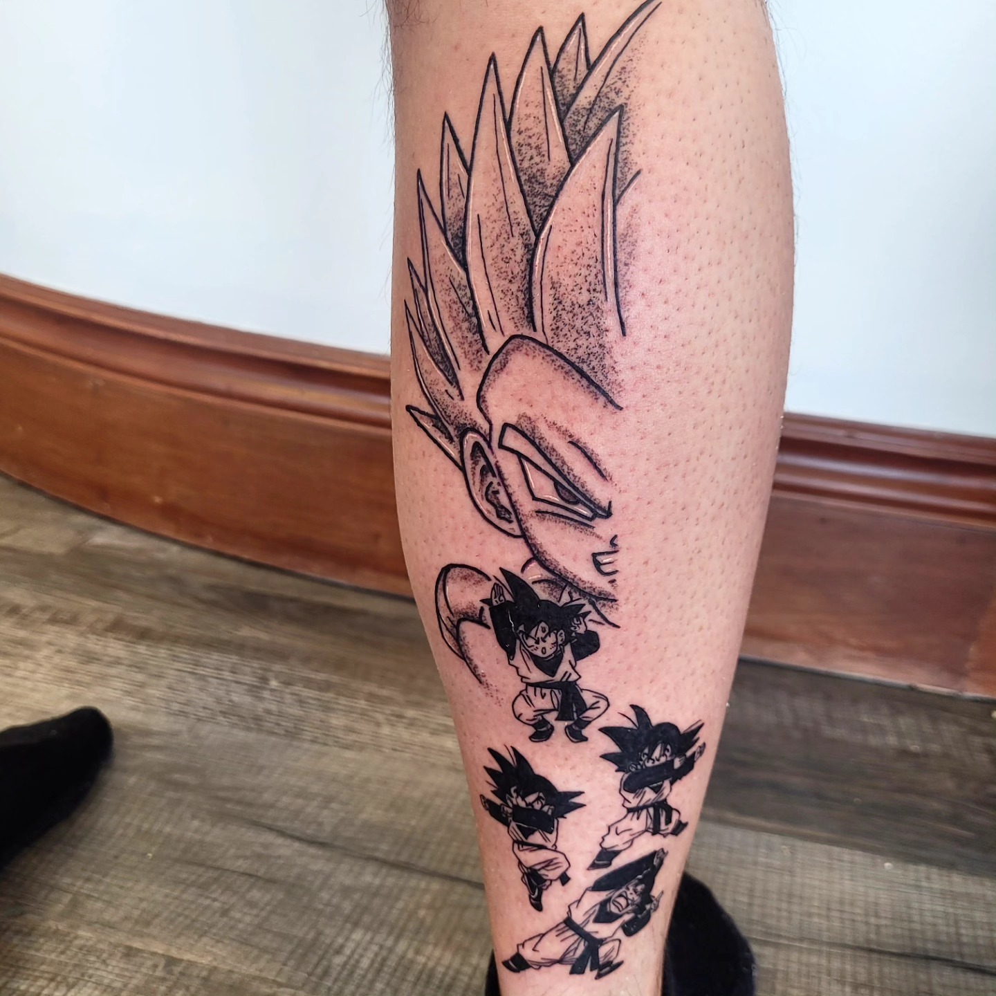 Goku evolution dotwork tattoo on the calf by Wray Saulsberry