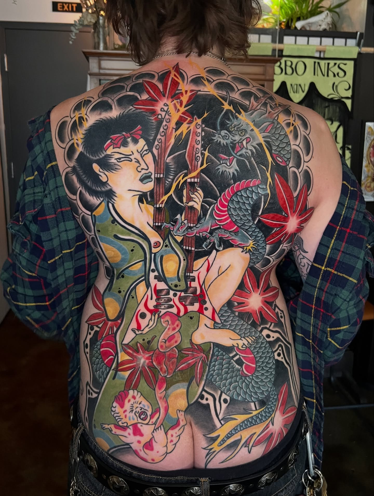 Geisha and dragon American traditional tattoo on the back by Belle Halverson