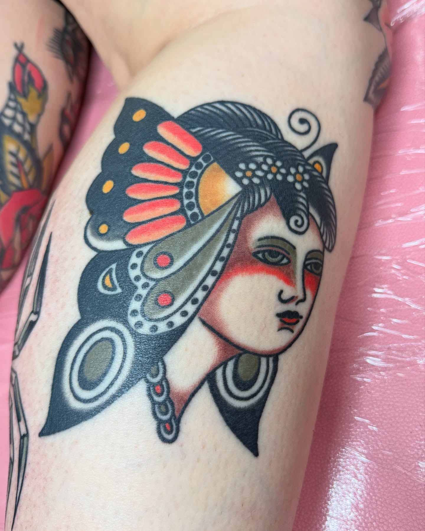 Geisha head American traditional tattoo on the thigh by Chaz Otto