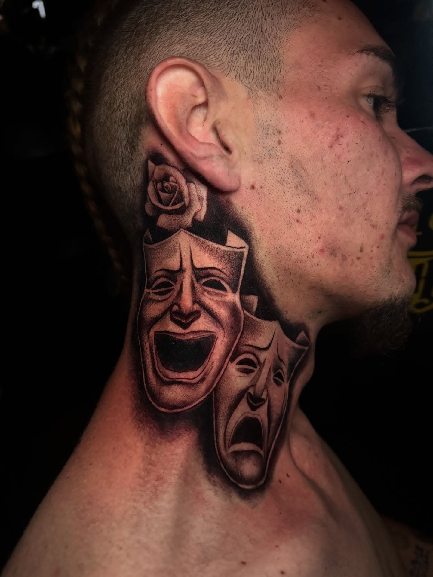 Theater masks black and grey tattoo on the neck by 𝕾𝖈𝖗𝖎𝖕𝖙 𝕾𝖕𝖊𝖈𝖎𝖆𝖑𝖎𝖘𝖙