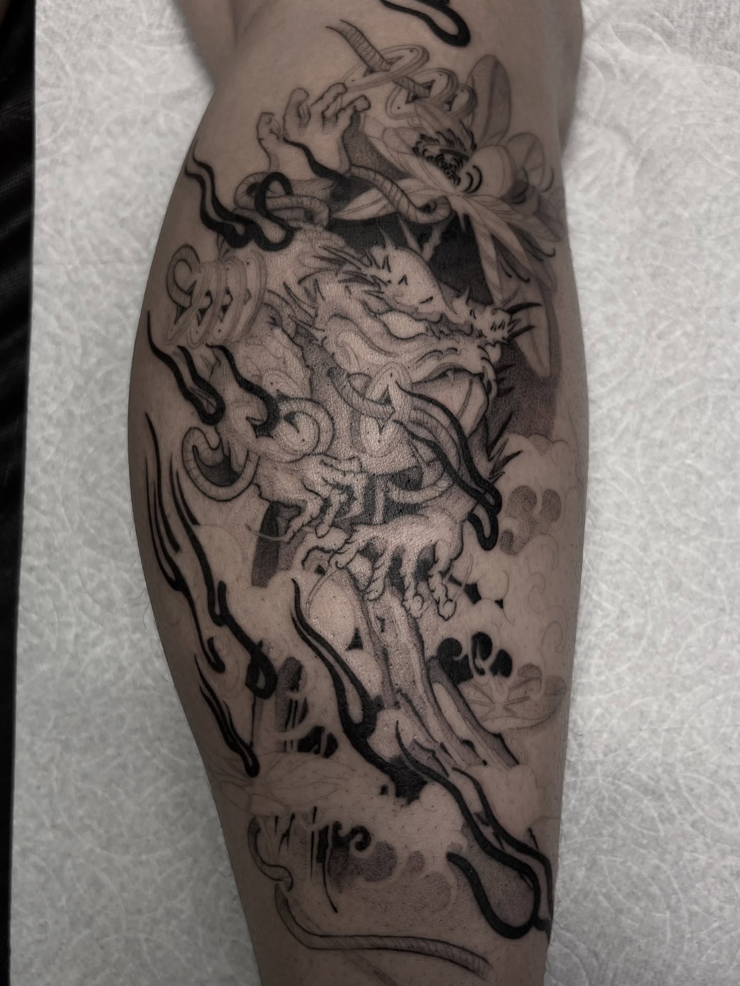 Dragon and clouds japanese irezumi tattoo on the forearm by Joshua Hung, Alhambra, California