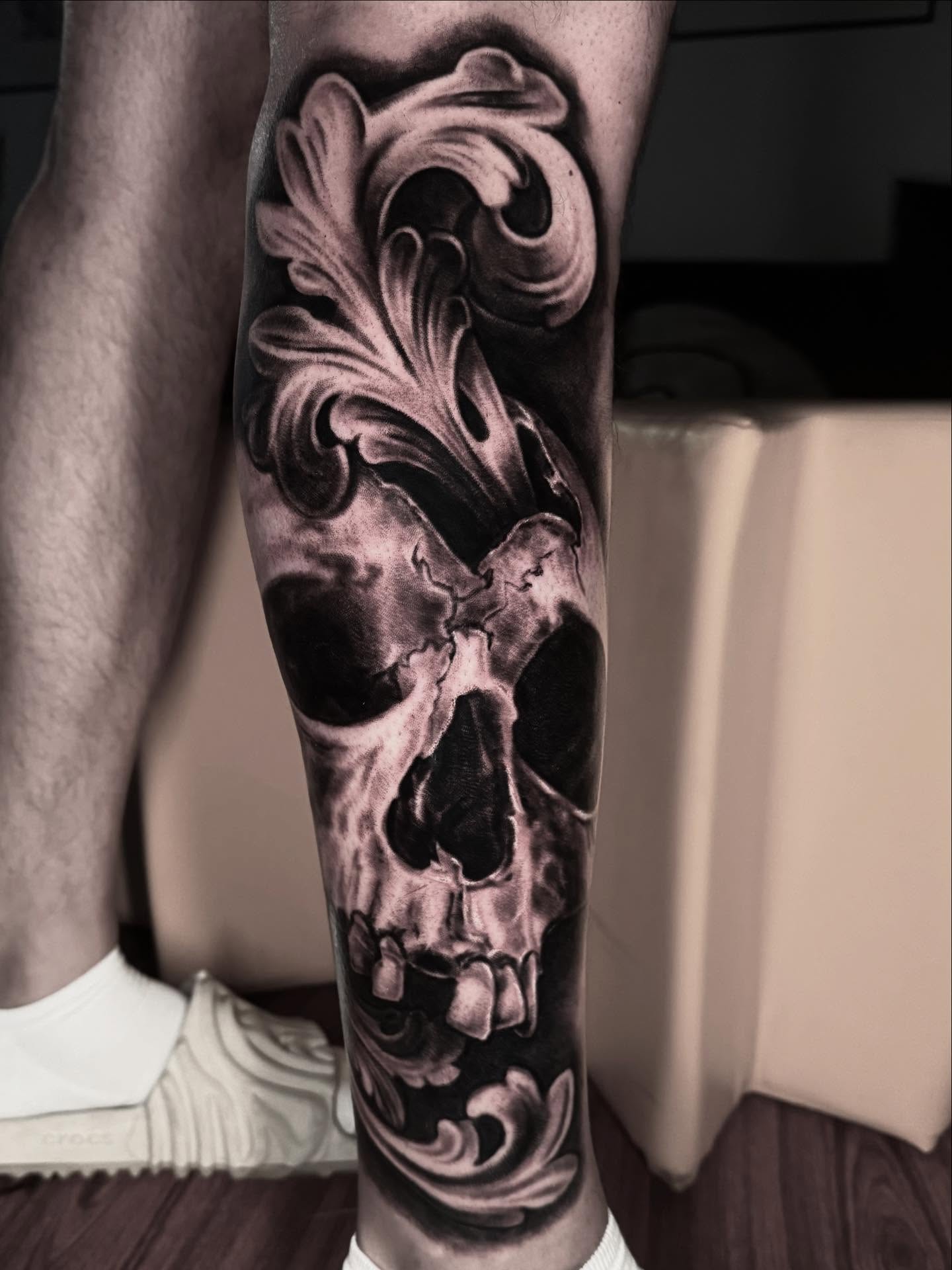 Skull realism tattoo on the forearm by Jeremiah Warner