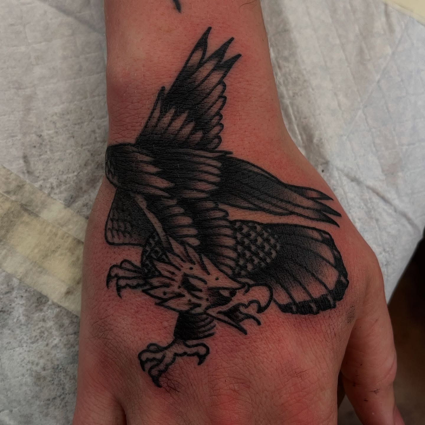 Hawk black and grey tattoo on the hand by Lee Brewster, Erlanger, Kentucky