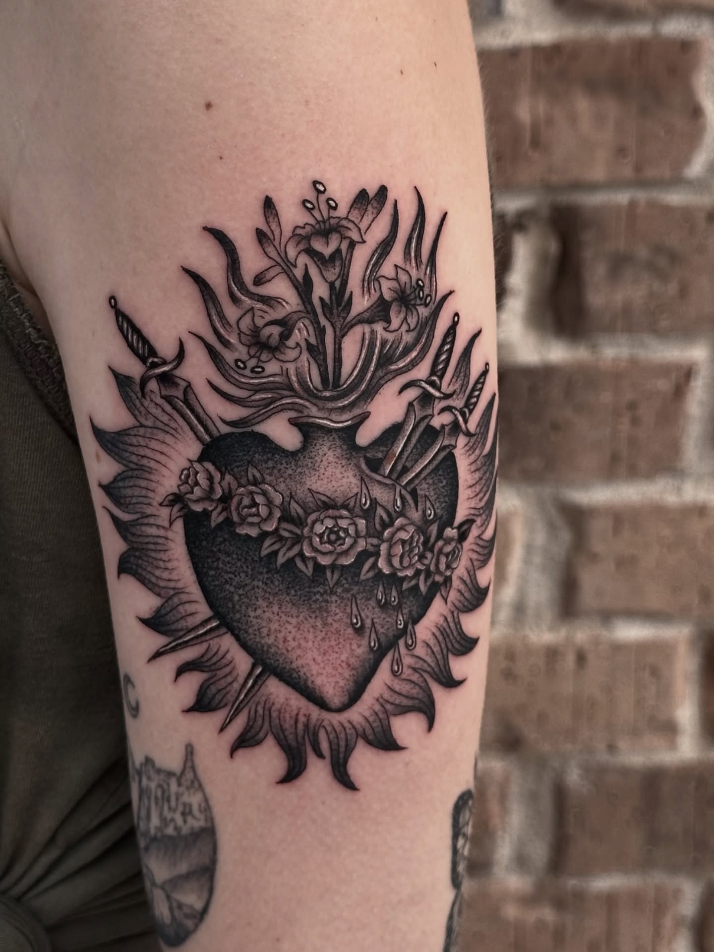 Heart with flowers black and grey tattoo on the forearm by Matthew, Georgetown, Texas