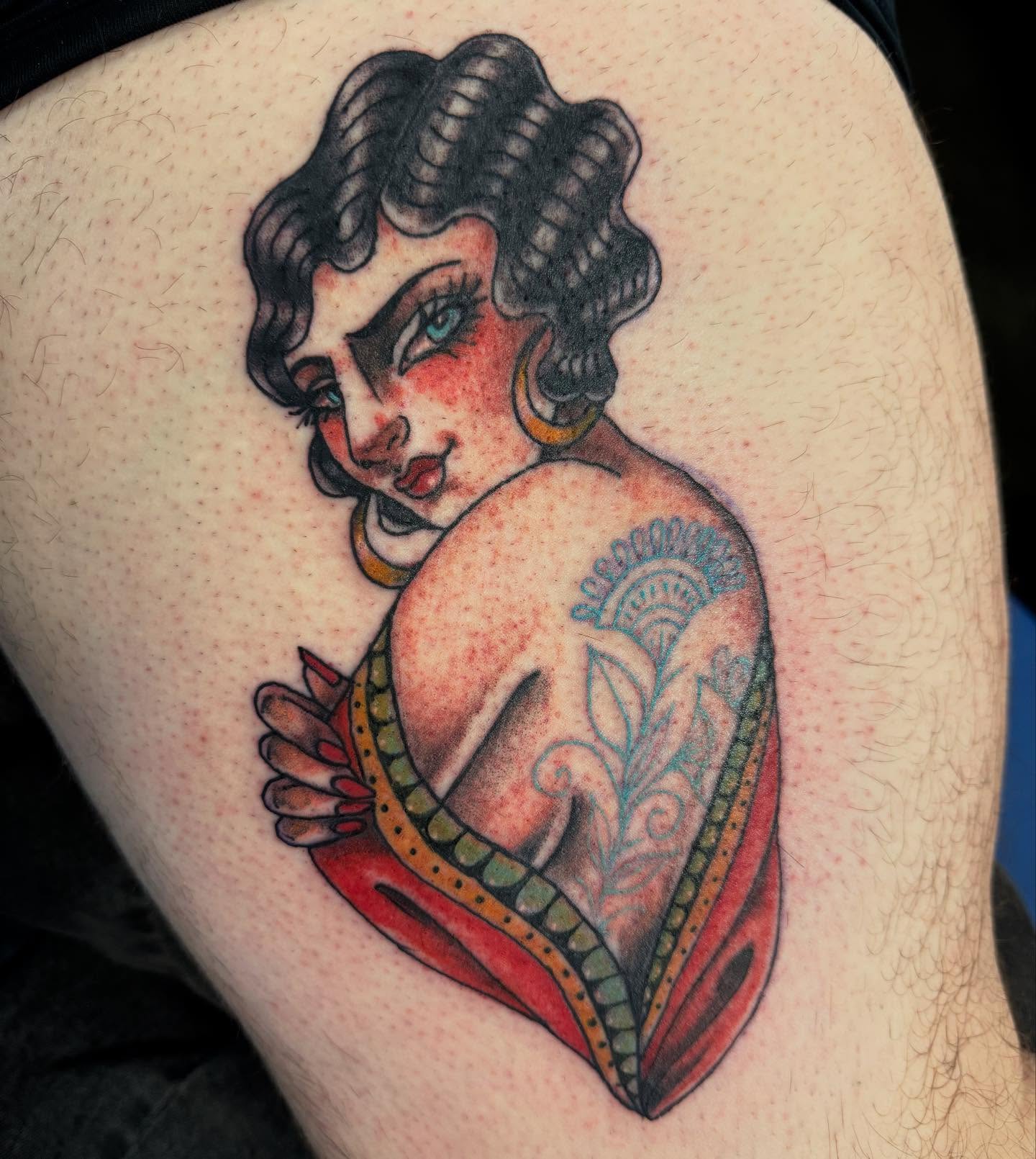 Woman with floral tattoo American traditional tattoo on the thigh by Tattoos By Trish