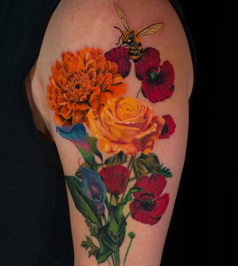 Floral bouquet realism tattoo on the upper arm by Paul Jack II ⚜️ Tattoo Artist ⚜️Atlanta