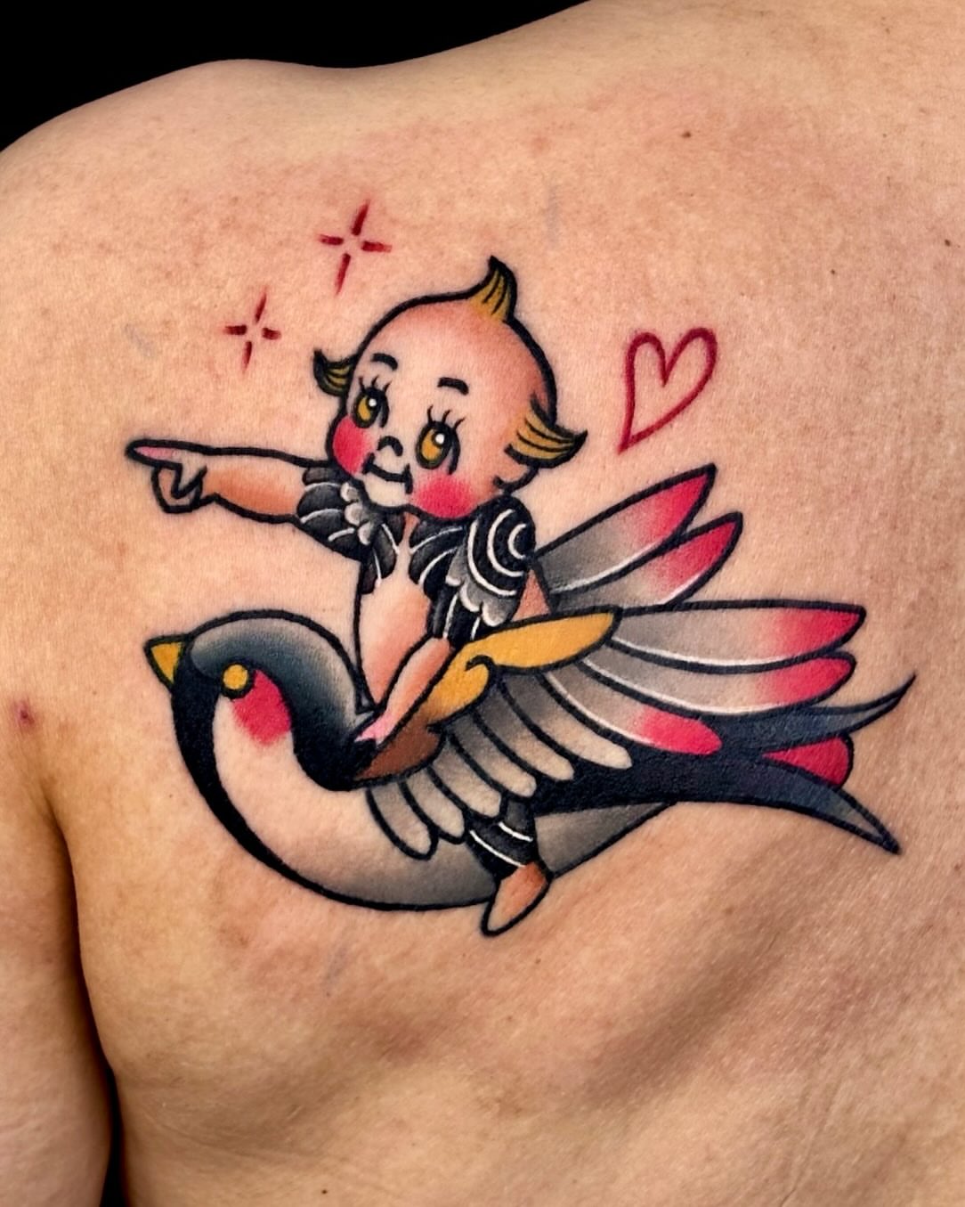 Angelic figure riding bird American traditional tattoo on the back by 부산타투
