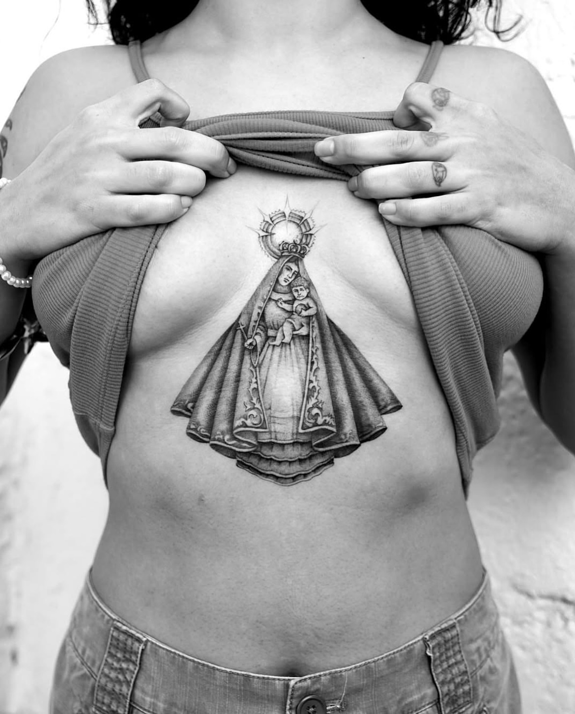Virgin mary and child black and grey tattoo on the chest by Chriscalibur