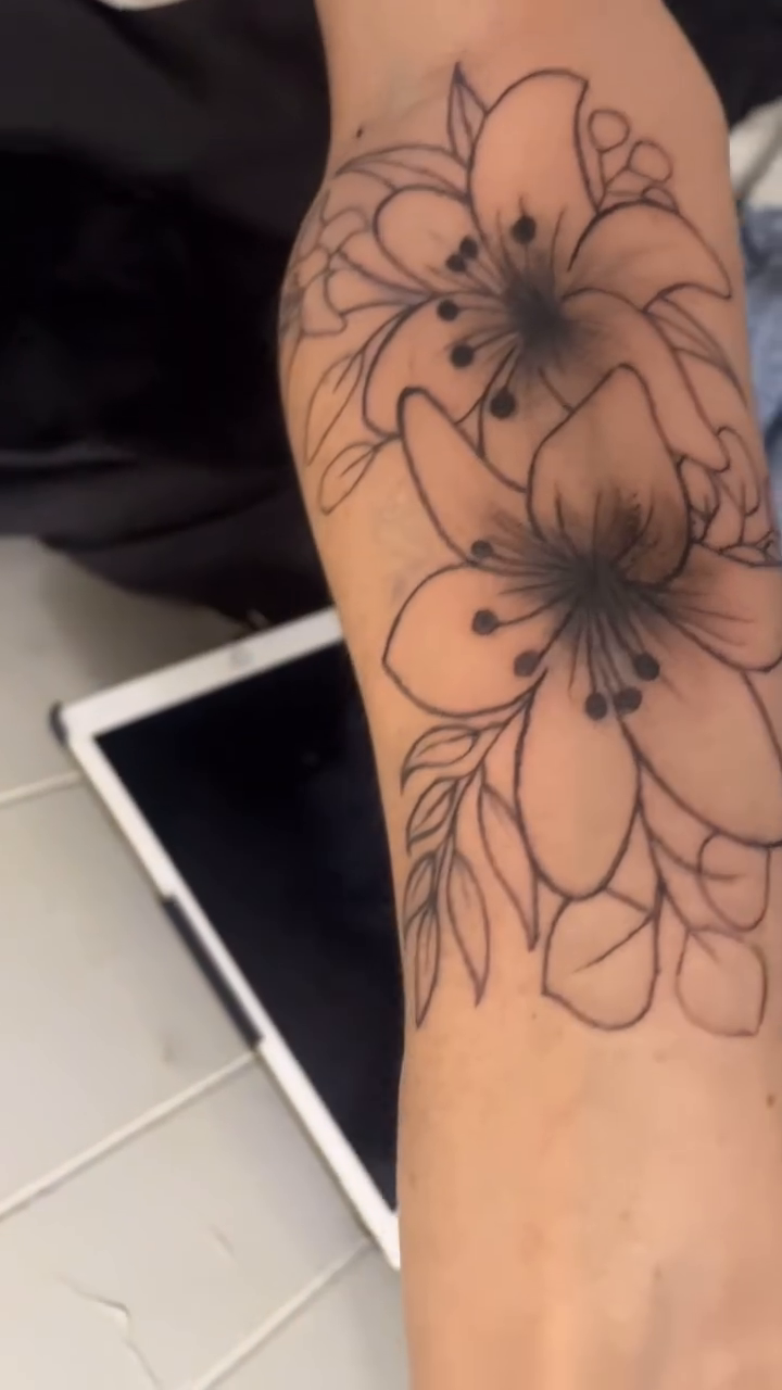 Lily flowers on arm fine line tattoo on the forearm by Ink_ Hustle36