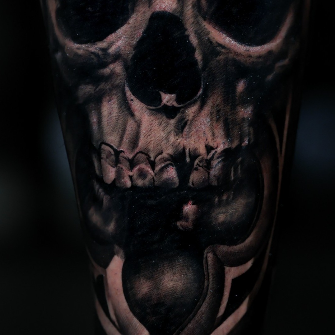 Skull dark art tattoo on the forearm by Felipe Andrade