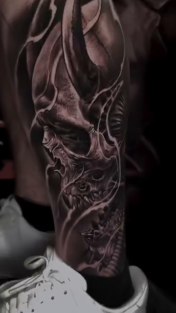 Demonic skull with horns dark realism tattoo by Tattoos By Chino