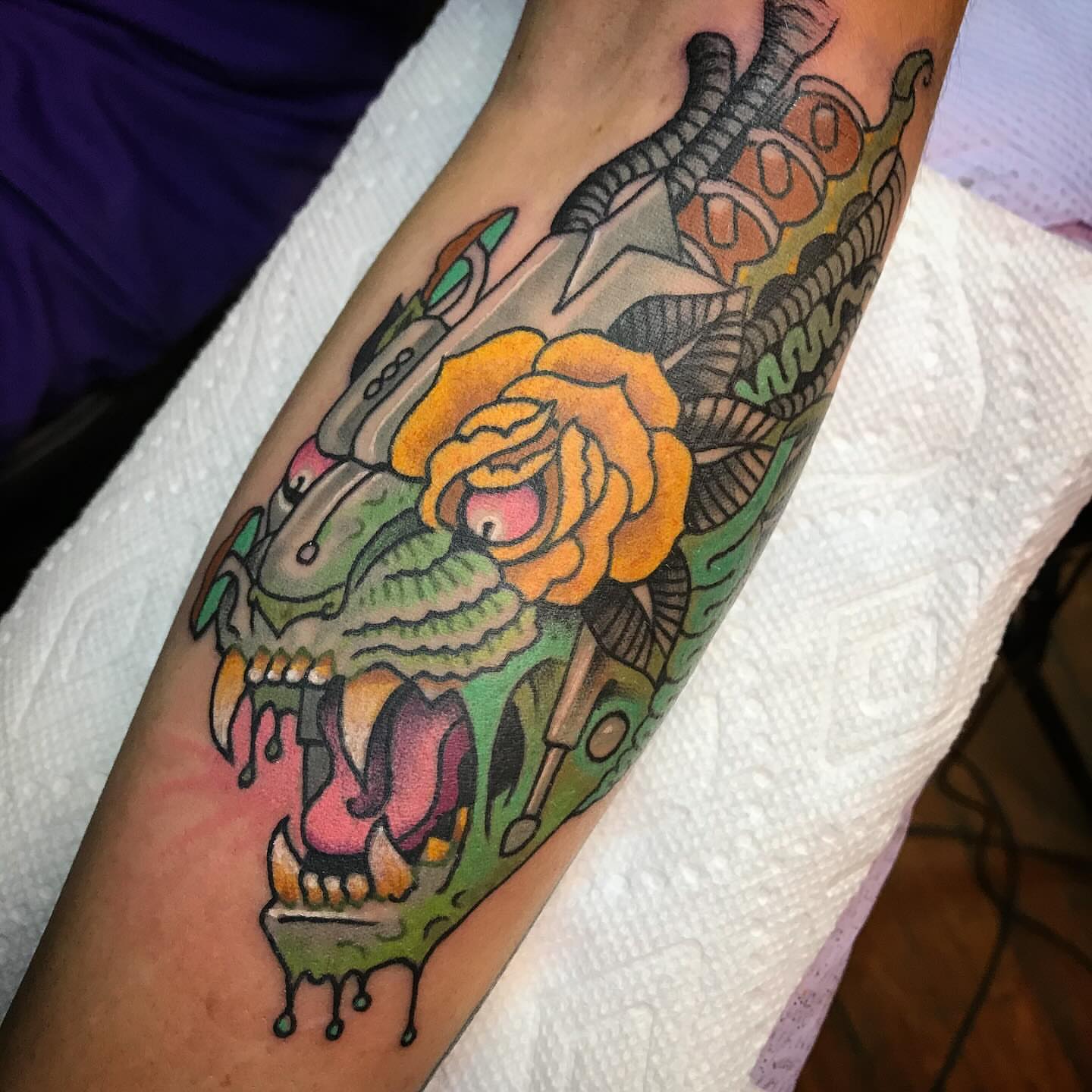 Skull with rose American traditional tattoo on the forearm by Ian Bederman, Austin, Texas