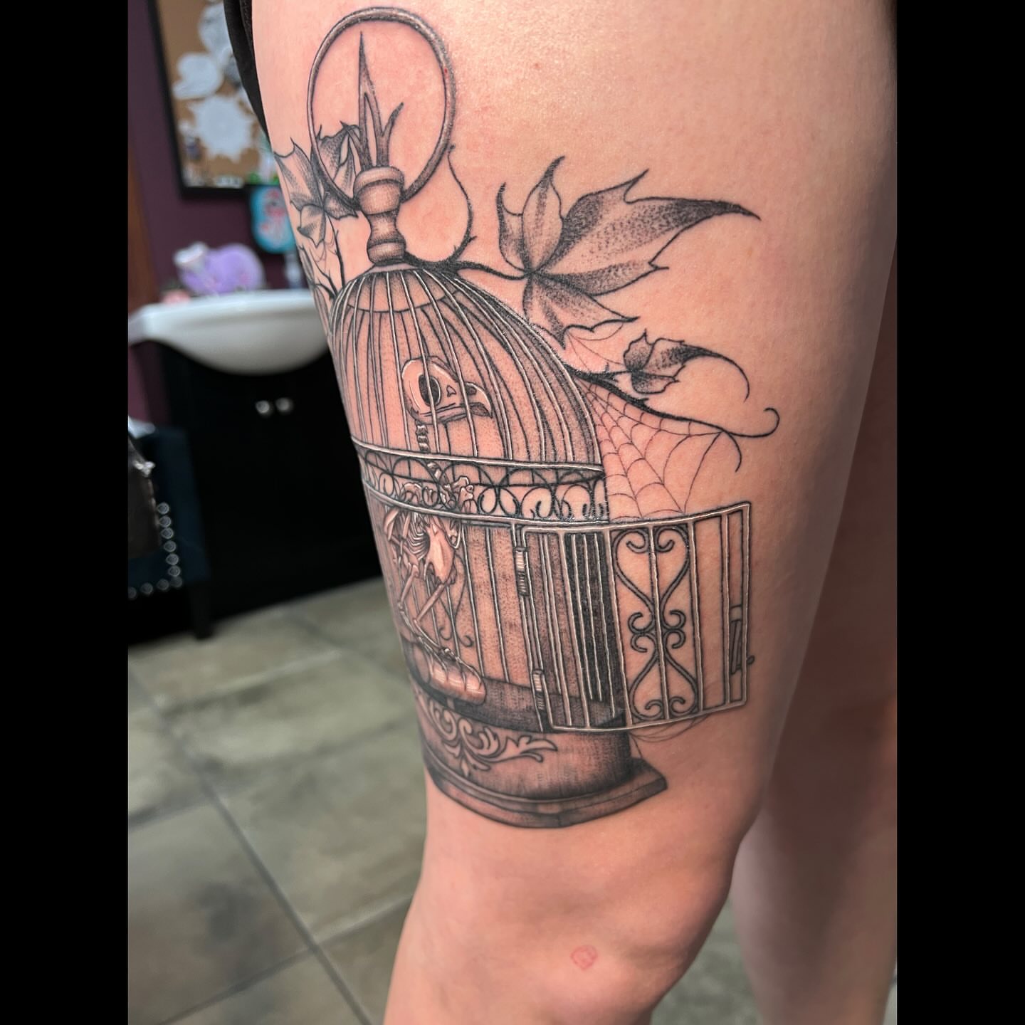 Birdcage realism tattoo on the forearm by Ali, Cedar Rapids, Iowa